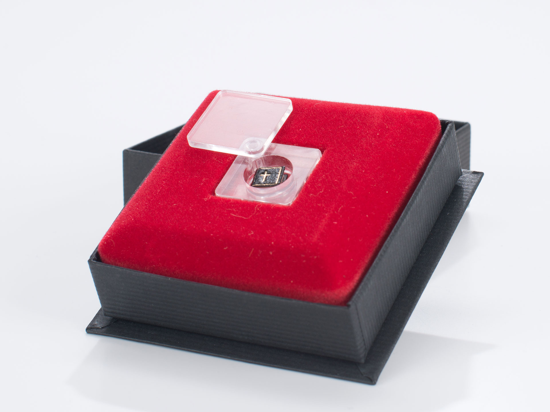 The "Smallest Book in the World". The Lord's Prayer (red)
